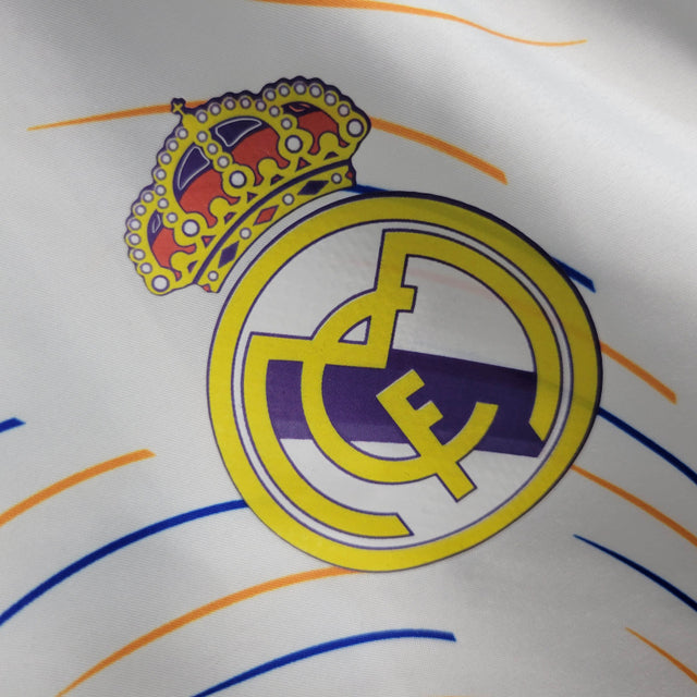 Jaqueta Corta-Vento Real Madrid 21/22 - Masculina Adidas - Branca com detalhes em azul e amarelo
