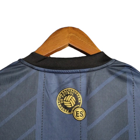 Camisa El Salvador 23/24 Torcedor Umbro Masculina - Azul com detalhes em preto e dourado