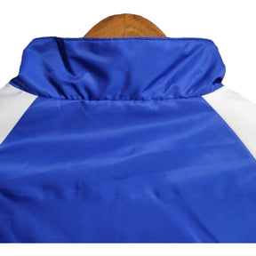 Jaqueta Corta-Vento Arsenal 23/24 - Azul com detalhes em branco e verde e vermelho